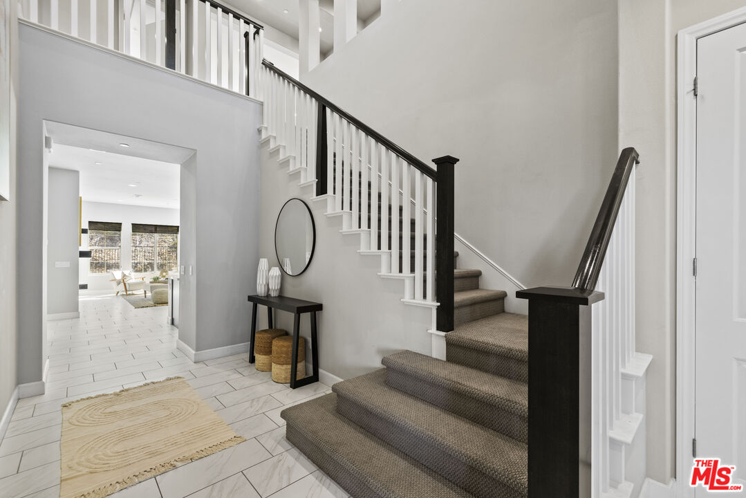 24220 Sterling Ranch Road West Hills, CA 91304 - Photo 9 of 39 a view of entryway and hall with wooden floor