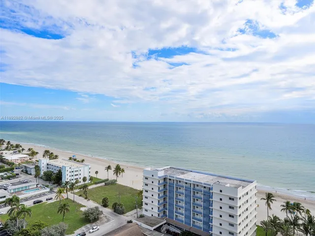 a view of a balcony with wooden floor