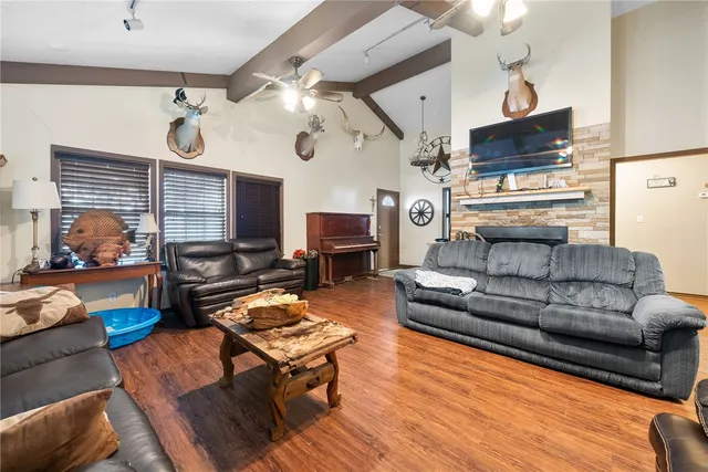a living room with furniture fireplace and flat screen tv