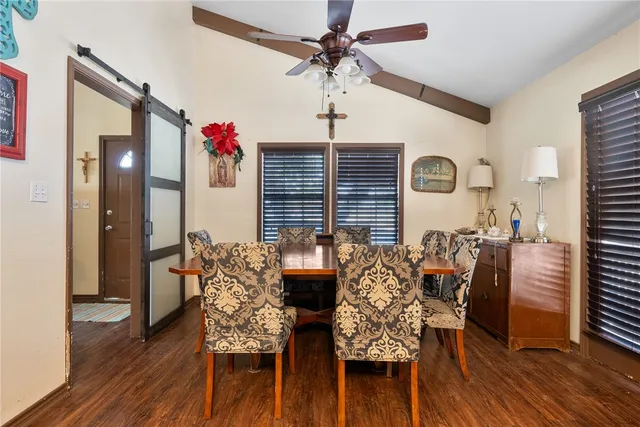a spacious bedroom with a bed and a window
