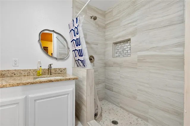 a bathroom with a toilet sink and shower