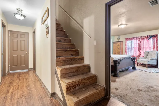 a house view with swimming pool in front of it