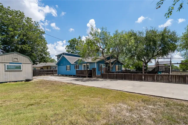 a view of a house with a park