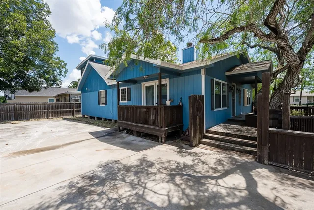 a view of a deck with wooden floor and outdoor seating