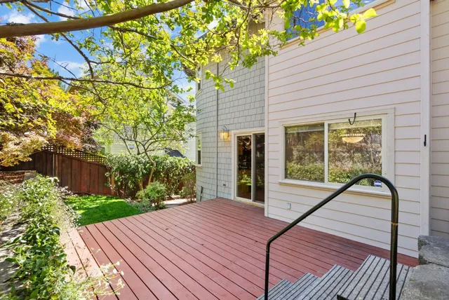 a view of a backyard with sitting area