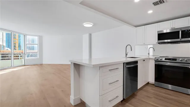 a kitchen with a stove and a sink