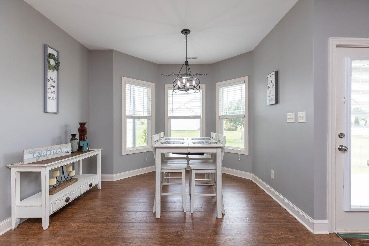 100 Celestial Drive Garner, NC 27529 - Photo 13 of 31 a view of a dining room with furniture window and wooden floor