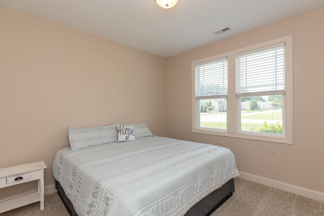 100 Celestial Drive Garner, NC 27529 - Photo 18 of 31 a bedroom with a bed and window