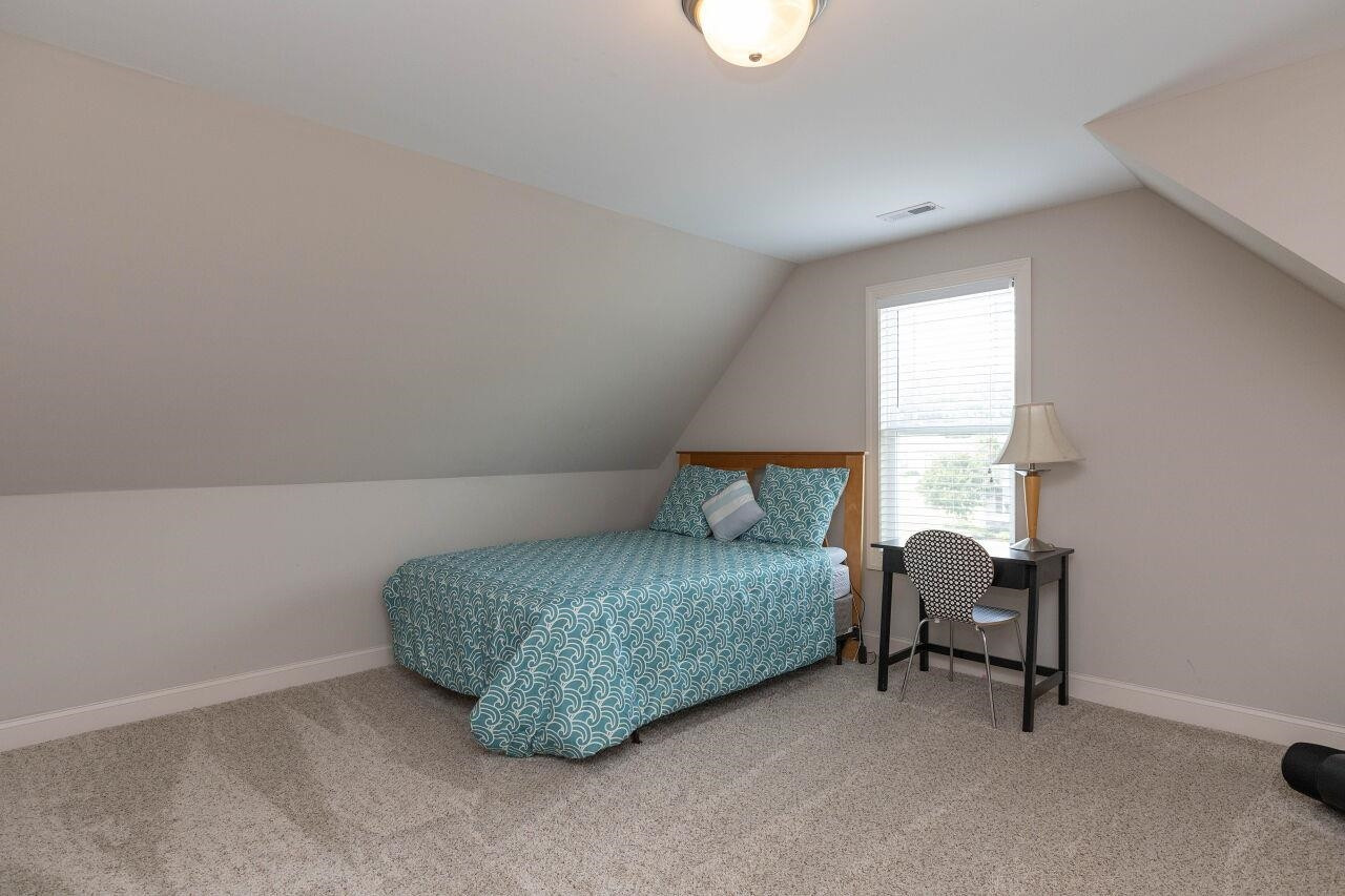 100 Celestial Drive Garner, NC 27529 - Photo 27 of 31 a bedroom with a bed and a window