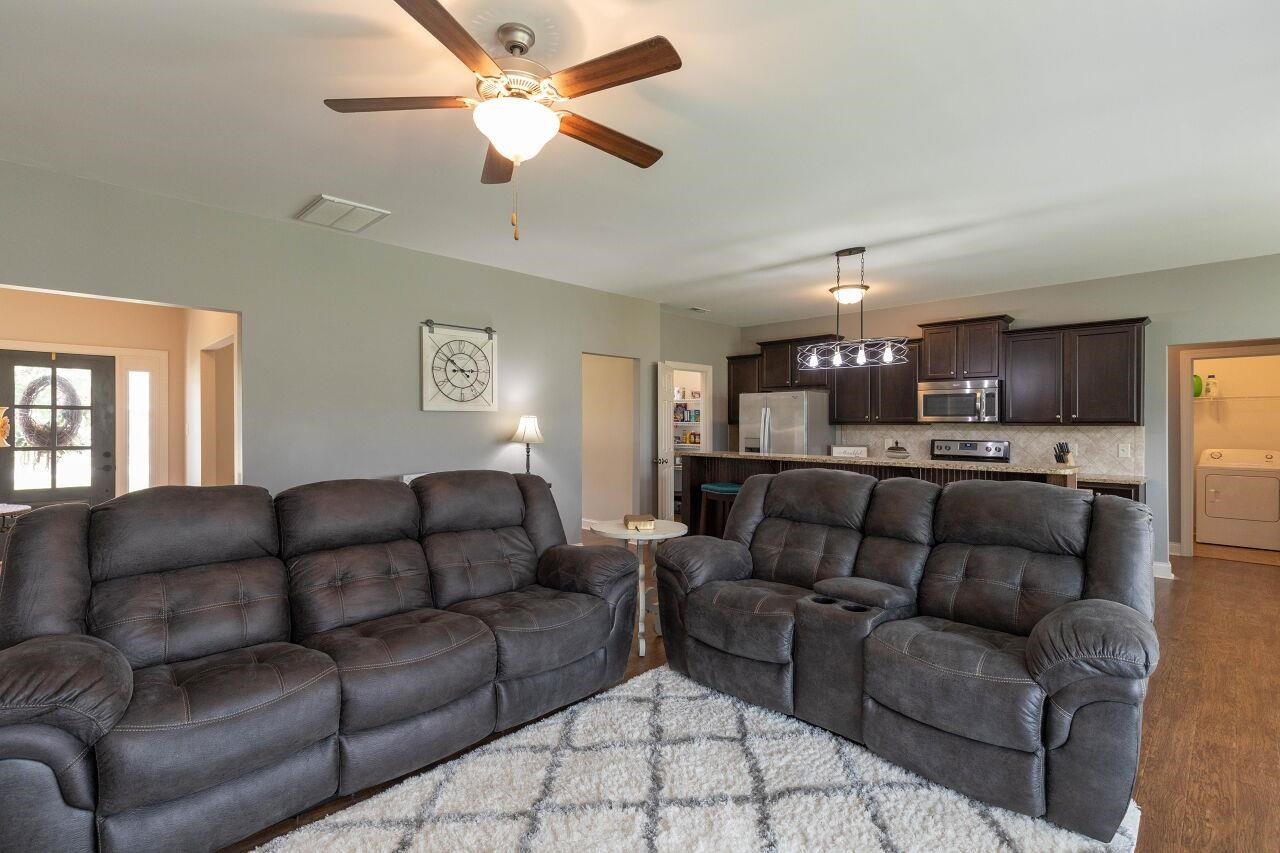 100 Celestial Drive Garner, NC 27529 - Photo 10 of 31 a living room with furniture and kitchen view