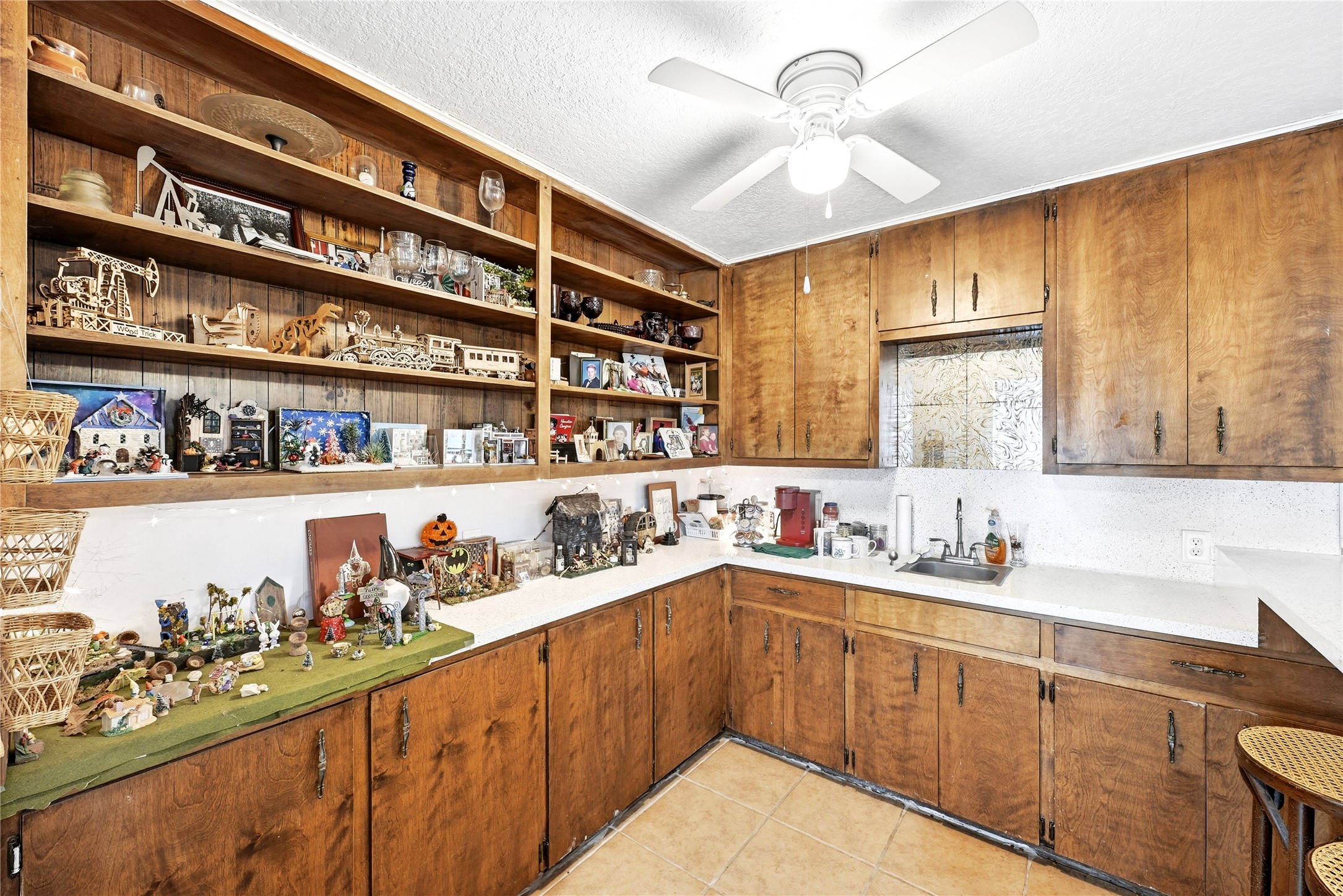 311 Salt Lake Road Luling, TX 78648 - Photo 18 of 37 This bar area serves as a hosting hub. Rich wood cabinetry, a sink with ample countertop space, expansive shelving and storage, and eat-in bar seating make this a highly functional space.