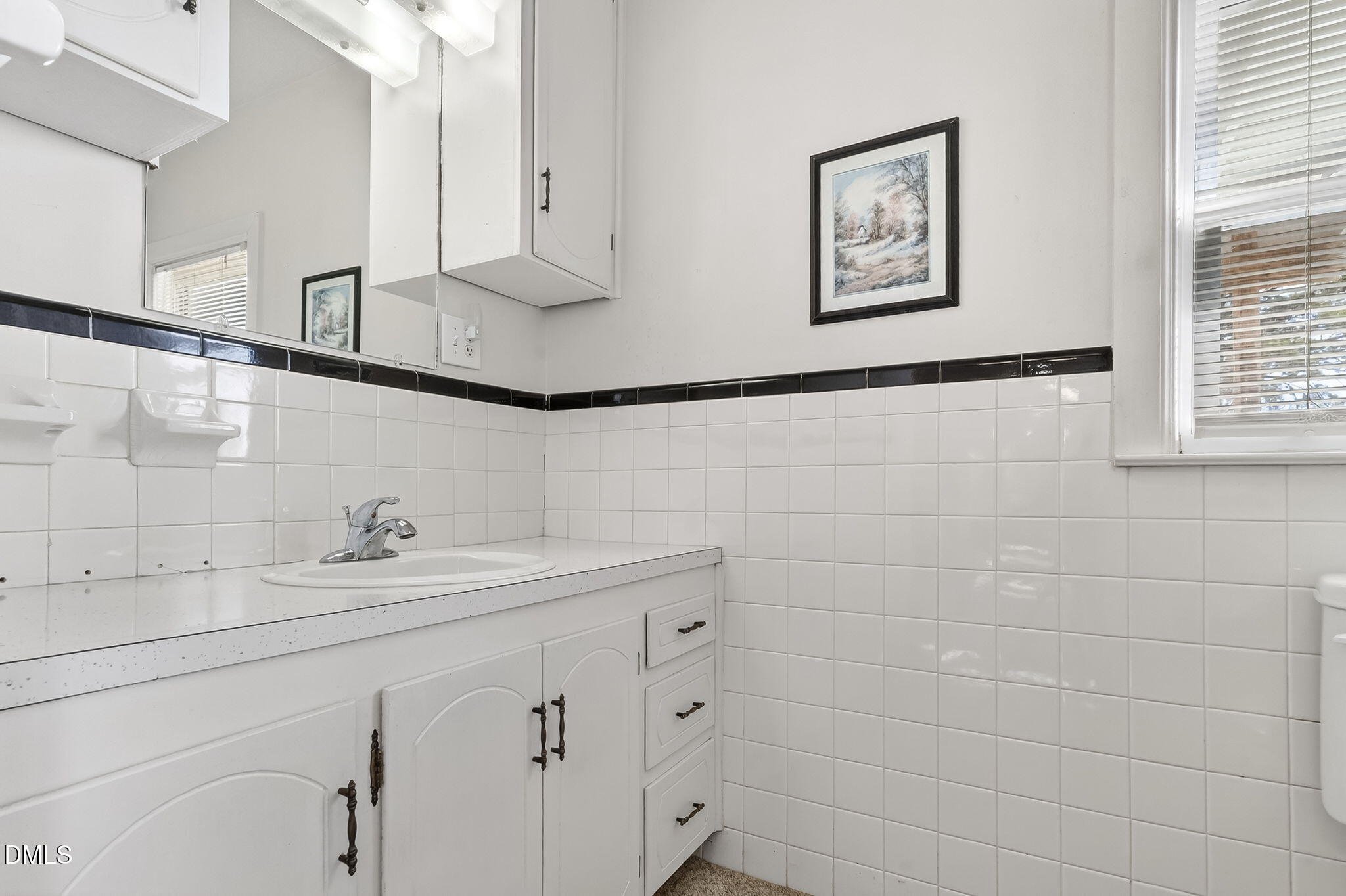3084 Tarheel Road Benson, NC 27504 - Photo 11 of 37 a bathroom with a sink and a mirror