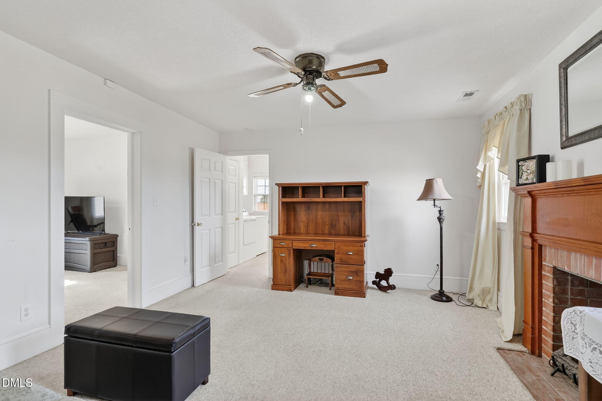 3084 Tarheel Road Benson, NC 27504 - Photo 19 of 37 a living room with furniture and a fireplace