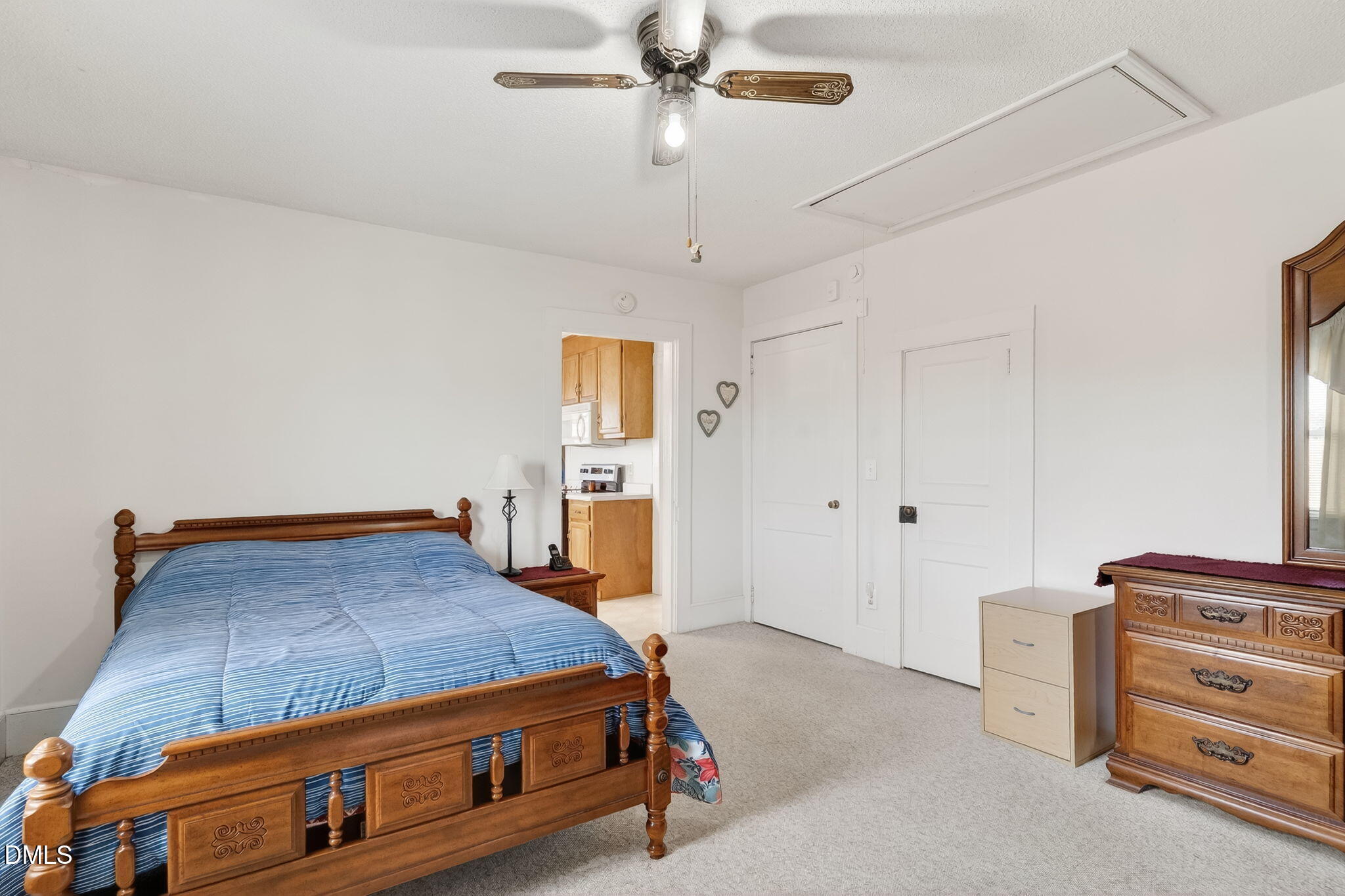 3084 Tarheel Road Benson, NC 27504 - Photo 21 of 37 a bedroom with a bed and a cabinets