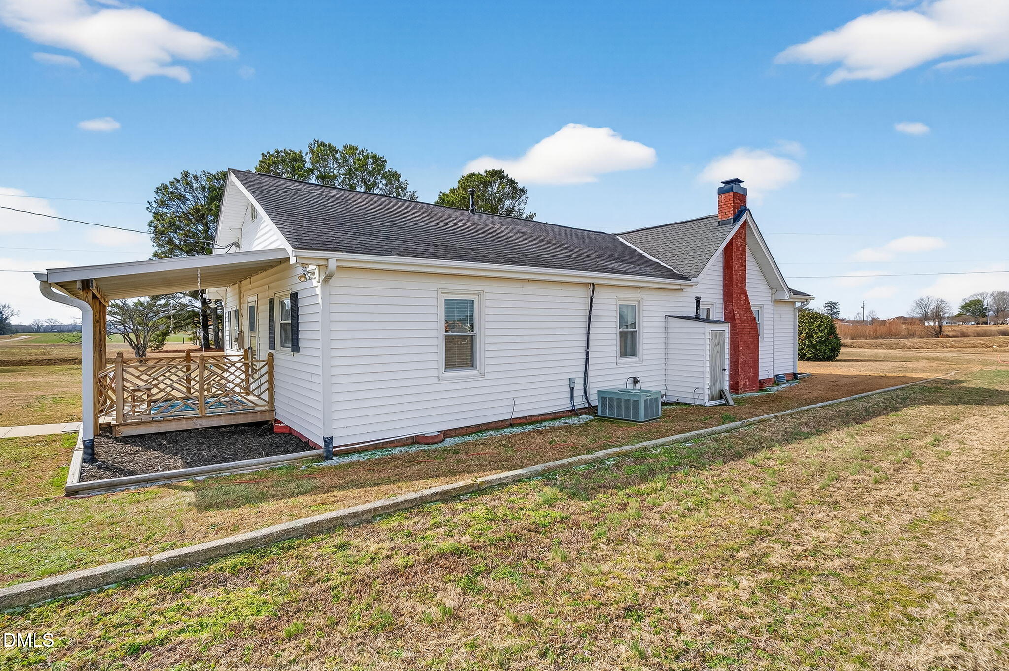 3084 Tarheel Road Benson, NC 27504 - Photo 27 of 37 a view of a house with a yard and potted plants