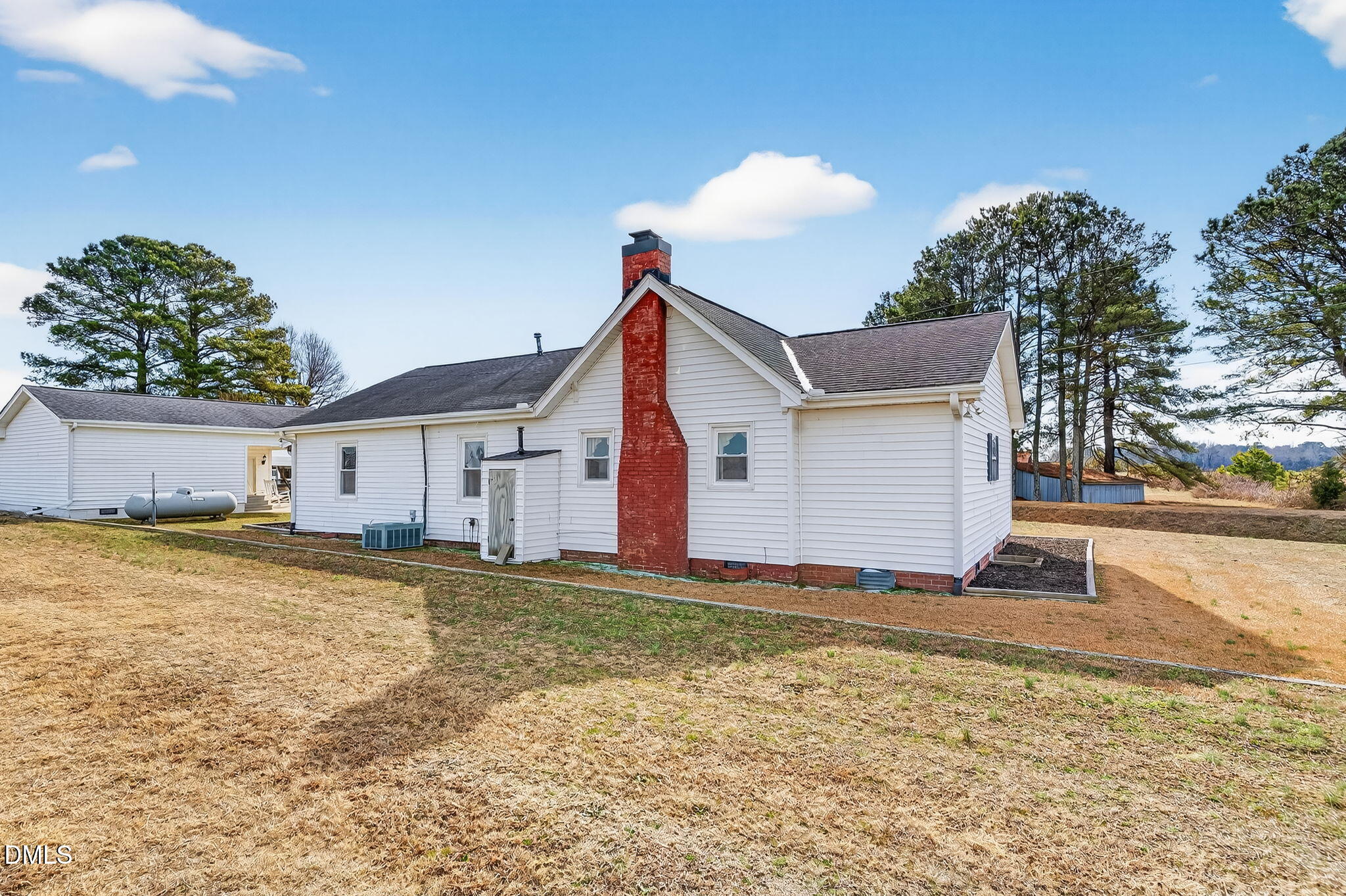 3084 Tarheel Road Benson, NC 27504 - Photo 29 of 37 a view of a house with a yard