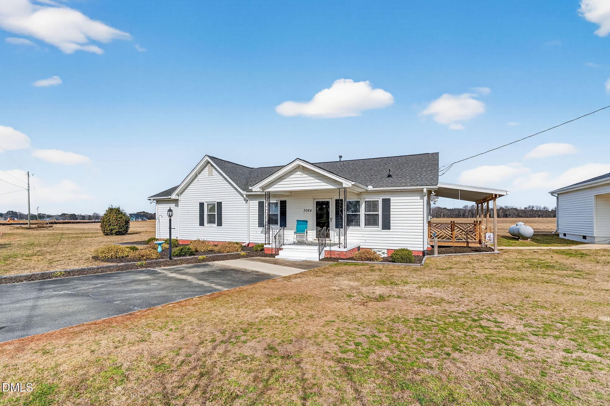 3084 Tarheel Road Benson, NC 27504 - Photo 3 of 37 a view of a house with a sink and lounge chairs