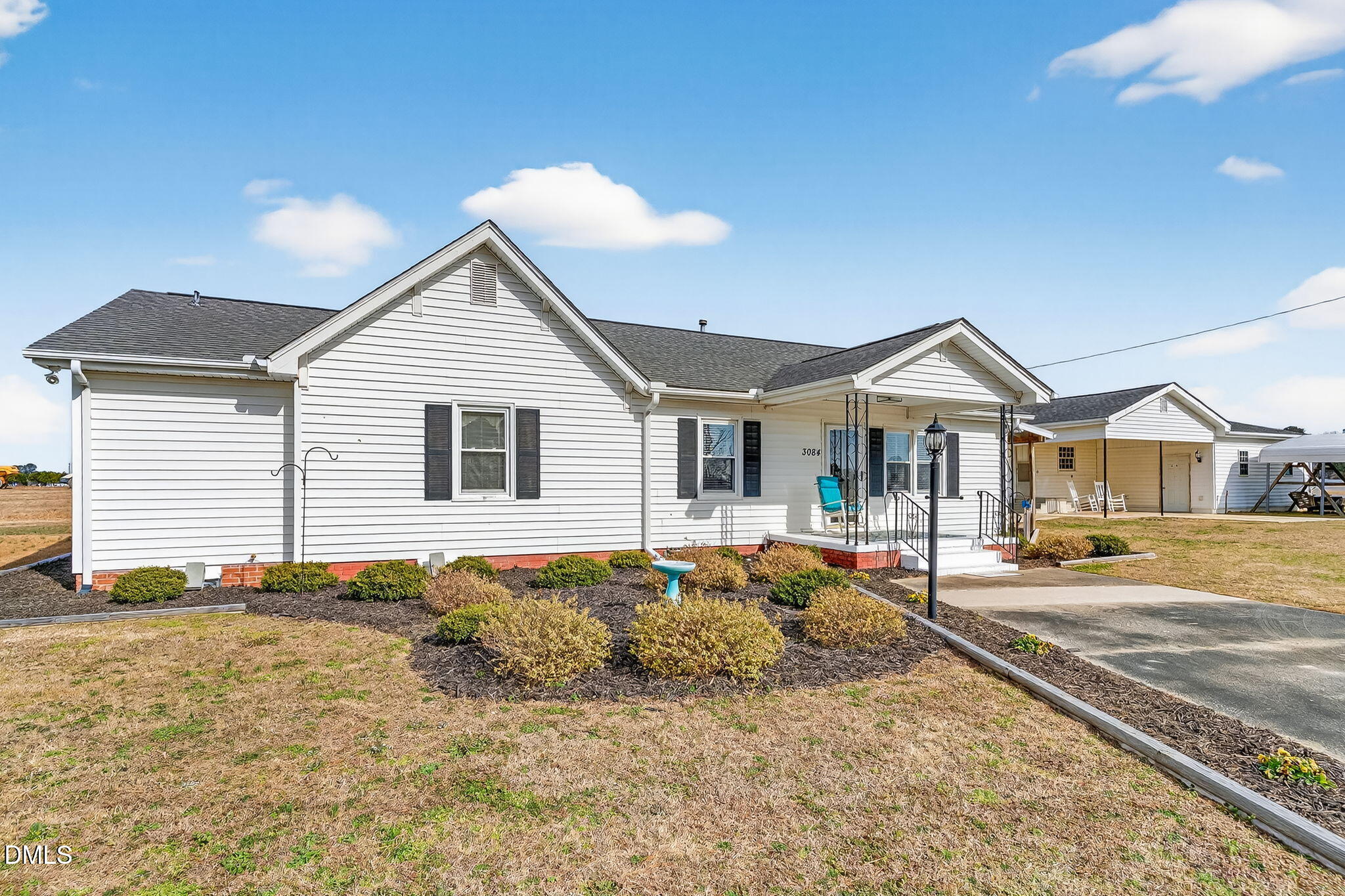 3084 Tarheel Road Benson, NC 27504 - Photo 4 of 37 a front view of a house with a yard