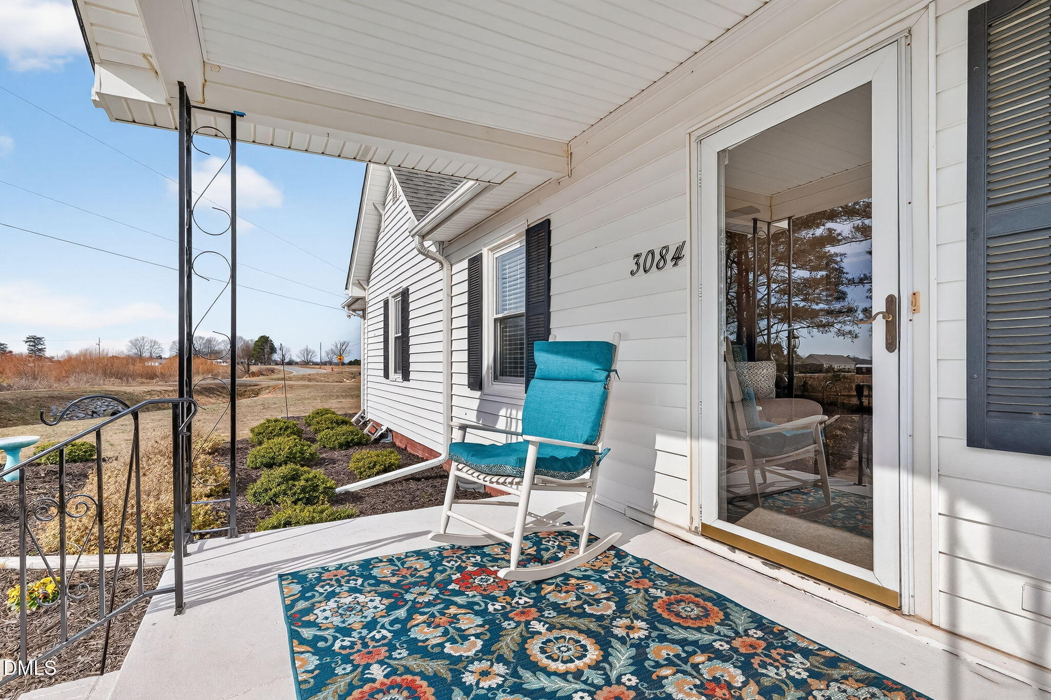 3084 Tarheel Road Benson, NC 27504 - Photo 5 of 37 a chair and table in a balcony