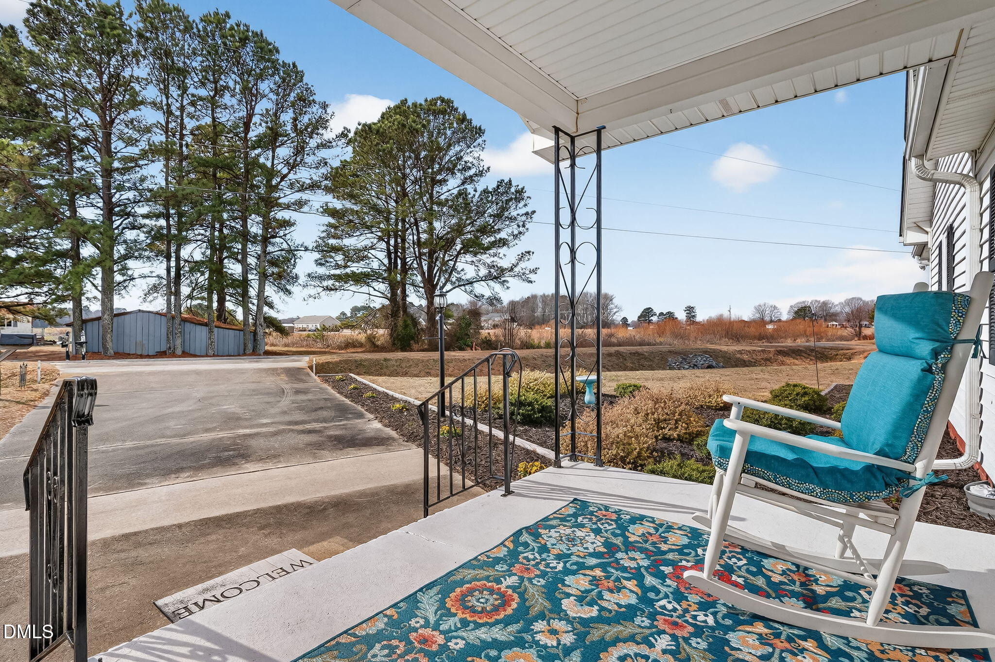 3084 Tarheel Road Benson, NC 27504 - Photo 7 of 37 a view of a patio with chairs and wooden floor