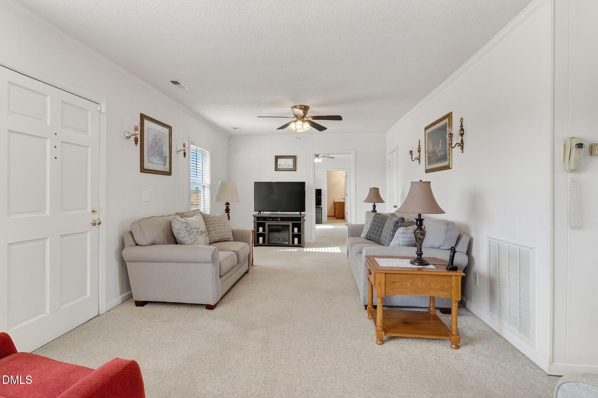 3084 Tarheel Road Benson, NC 27504 - Photo 8 of 37 a living room with furniture and a flat screen tv