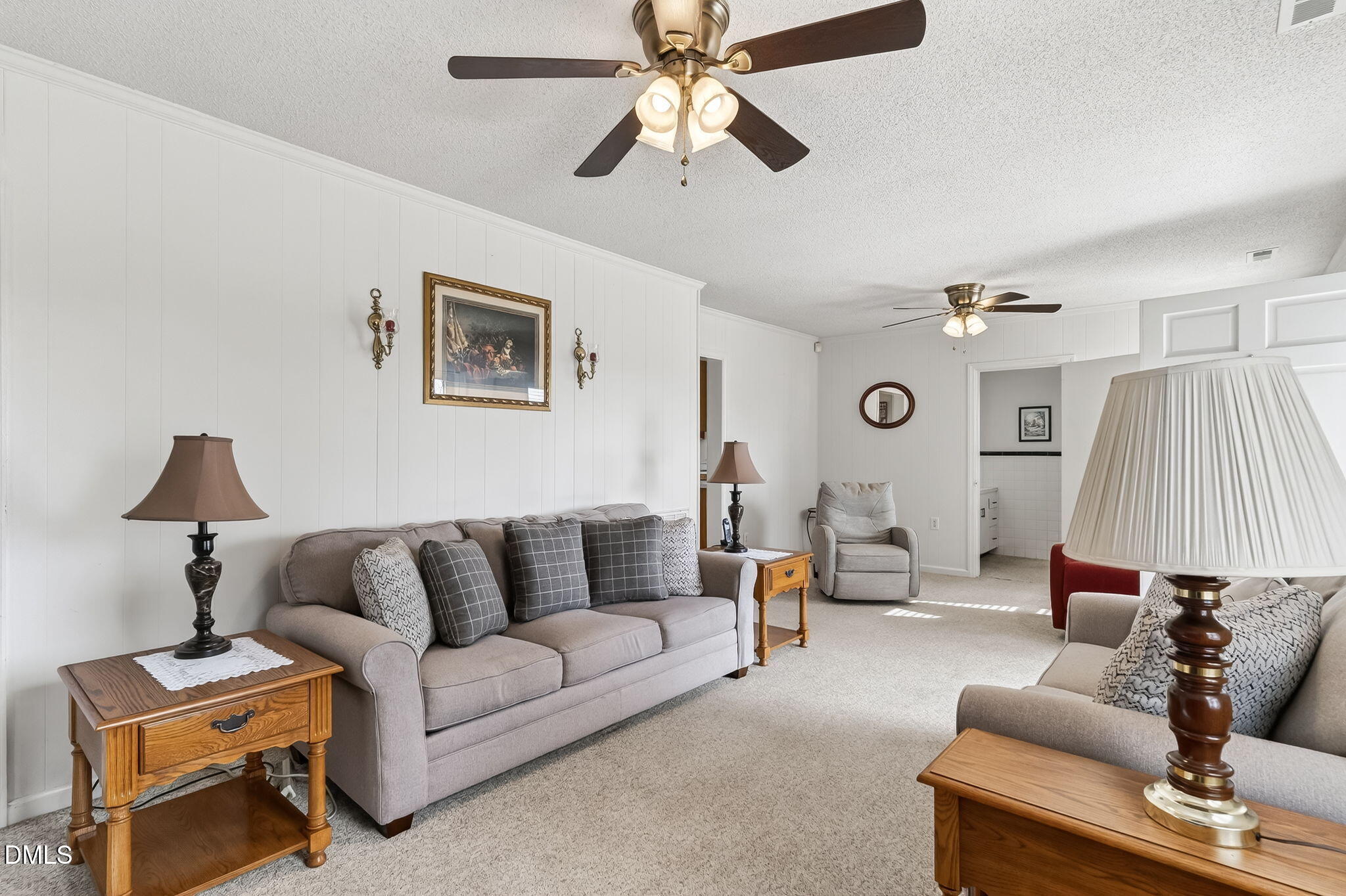 3084 Tarheel Road Benson, NC 27504 - Photo 9 of 37 a living room with furniture and a lamp