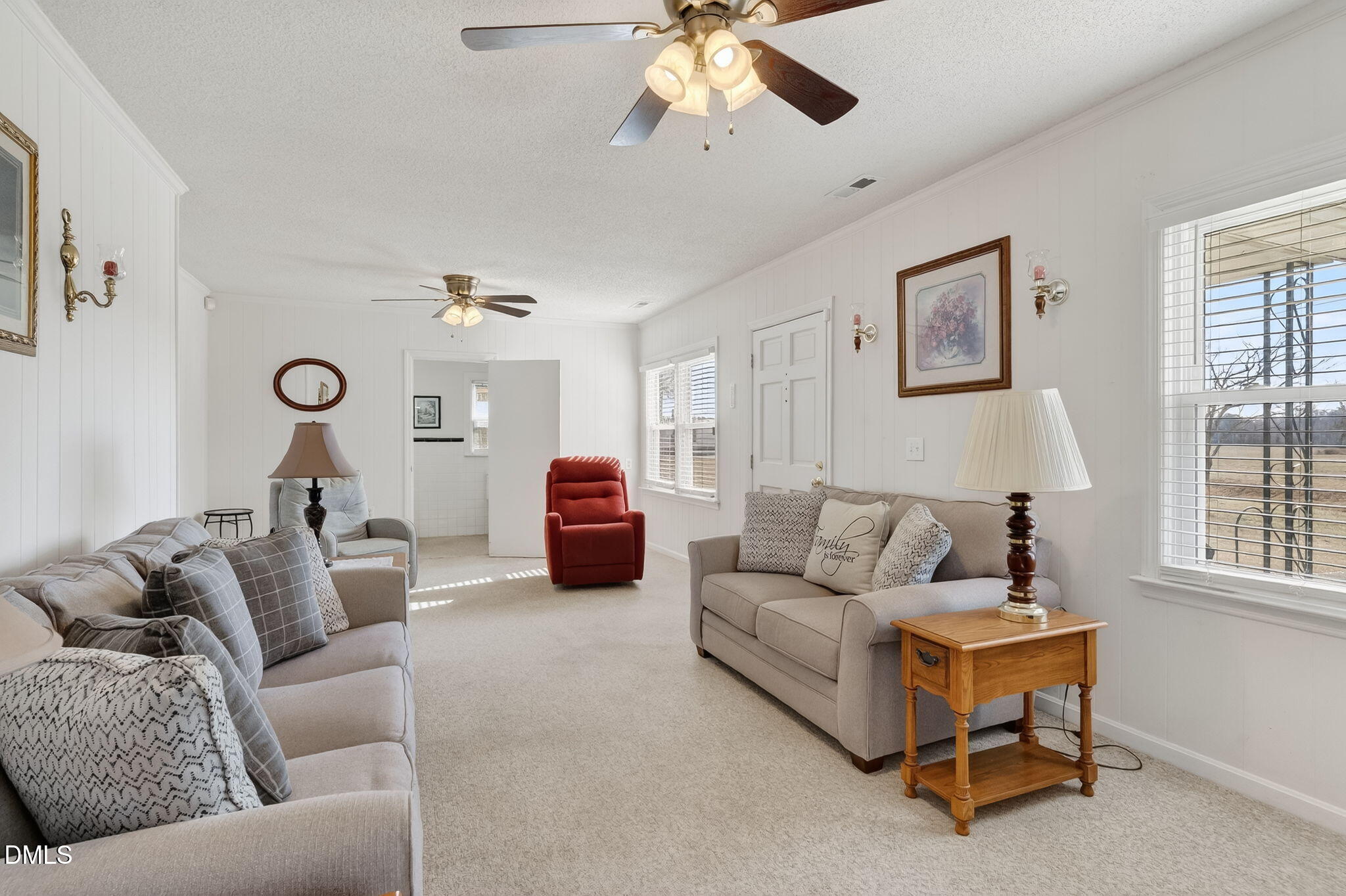 3084 Tarheel Road Benson, NC 27504 - Photo 10 of 37 a living room with furniture and a window