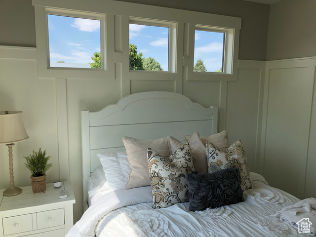 658 West 500 South Logan, UT 84321 - Photo 19 of 25 Bedroom featuring a decorative wall and wainscoting