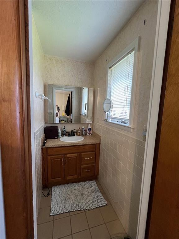 671 York Run Road Smithfield, PA 15478 - Photo 20 of 49 a bathroom with a sink a mirror and a vanity