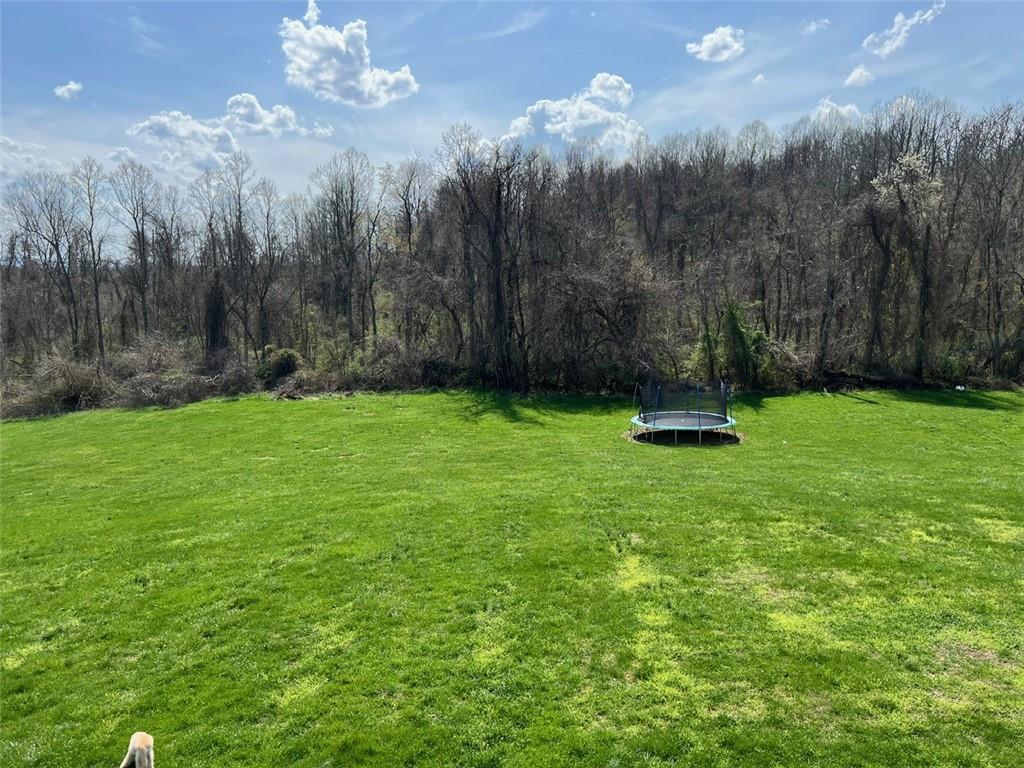 671 York Run Road Smithfield, PA 15478 - Photo 36 of 49 a view of a fire pit with trees in the background