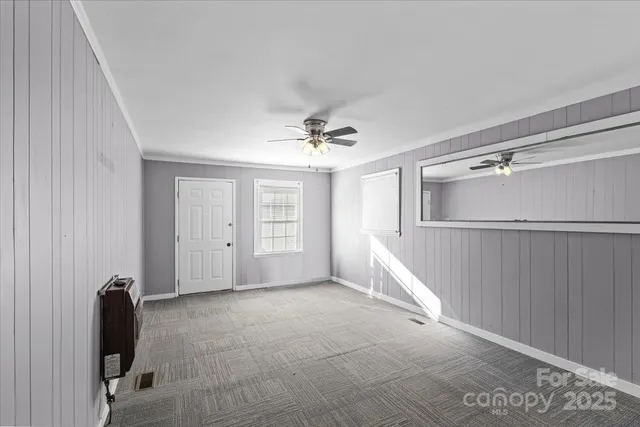 a view of livingroom with hardwood floor and a ceiling fan