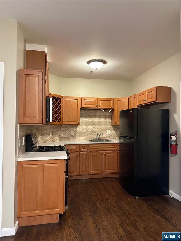 500 Fulton Street, Unit 1 Elizabeth, NJ 07206 - Photo 2 of 4 a kitchen with stainless steel appliances granite countertop a refrigerator a stove and a sink