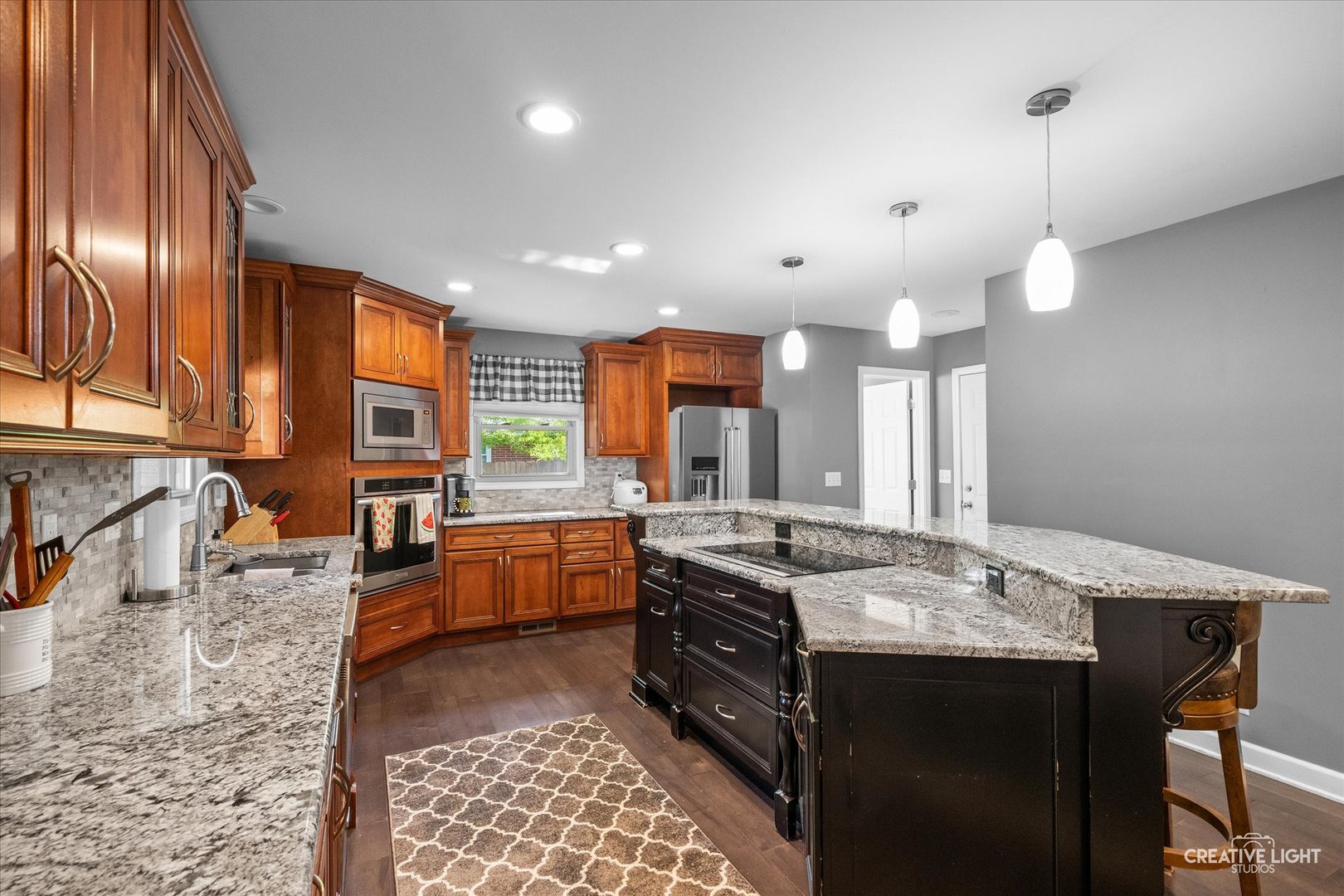 92 Neil Road Sugar Grove, IL 60554 - Photo 8 of 34 a large kitchen with granite countertop a stove oven and a sink with granite countertops