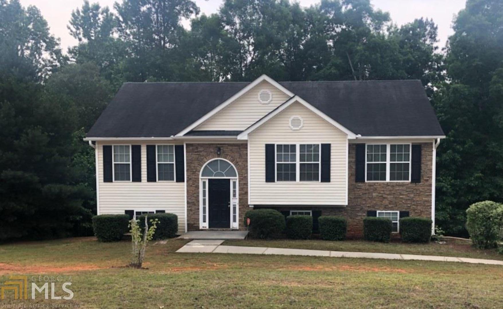 35 Lamar Lane Covington, GA 30016 - Photo 1 of 1 a front view of a house with a yard