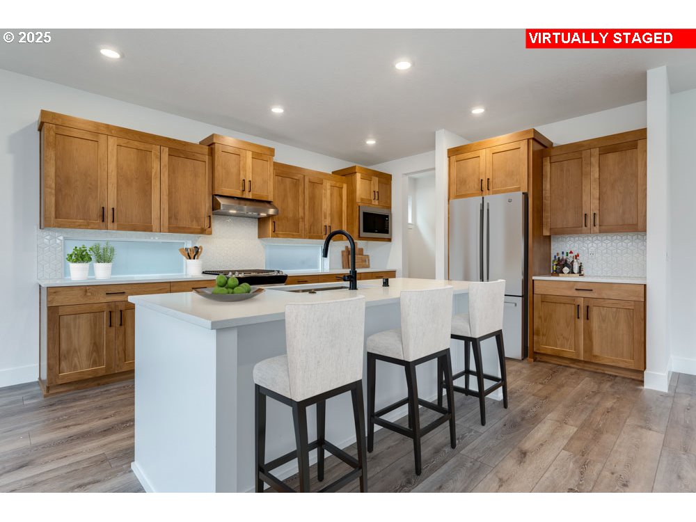 1324 East Canto Newberg, OR 97132 - Photo 3 of 10 a kitchen with a sink cabinets and wooden floor