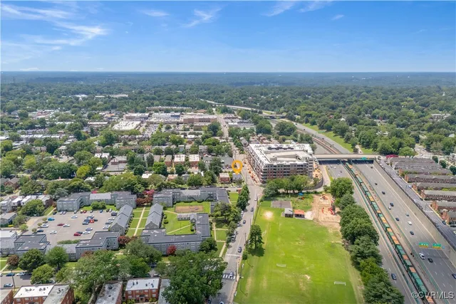an aerial view of residential houses with outdoor space