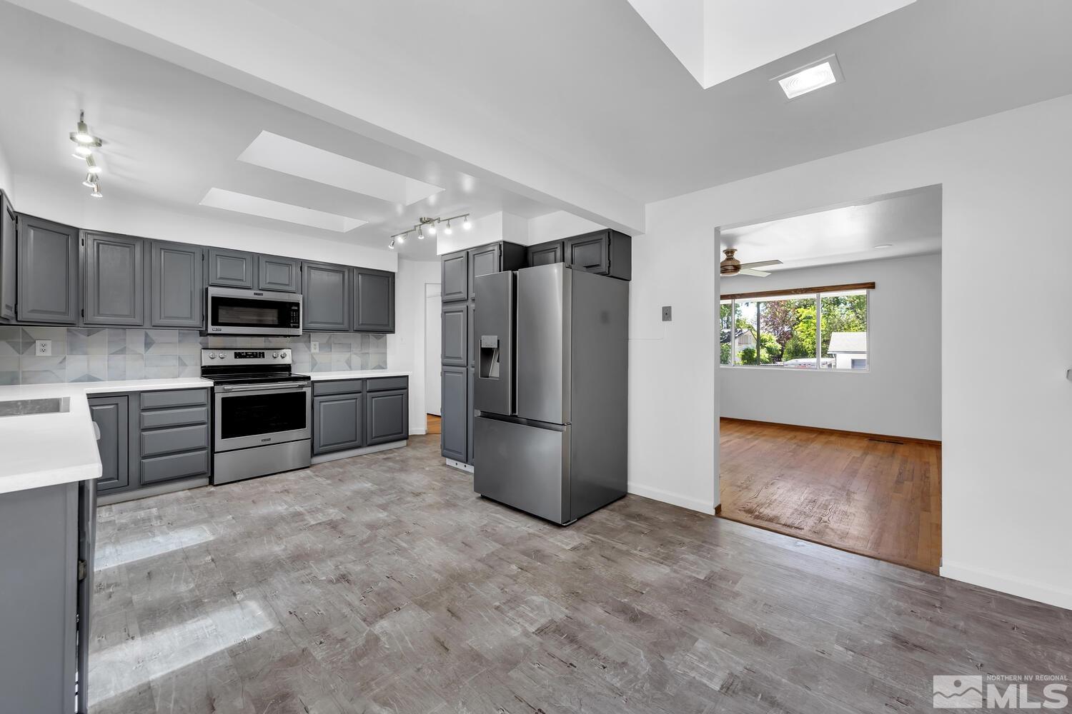 895 Grandview Avenue Reno, NV 89503 - Photo 9 of 39 a kitchen with a refrigerator and a stove top oven