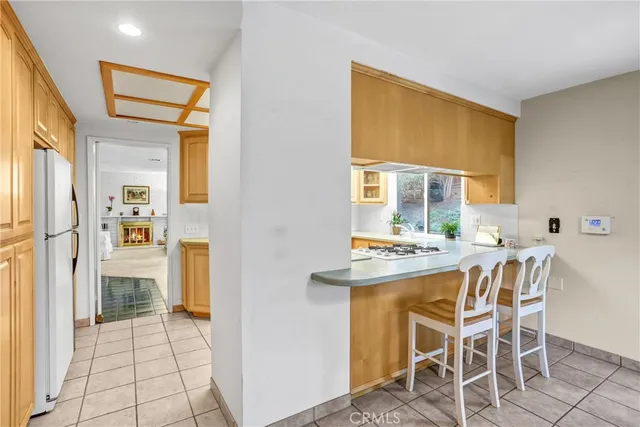 a kitchen with a table and chairs