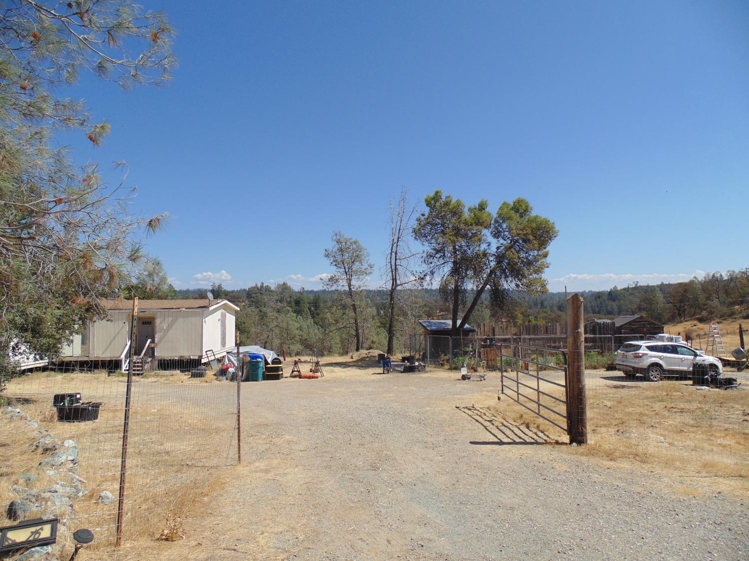 4161 Ginger Road Garden Valley, CA 95633 - Photo 15 of 32 a view of road with a car parked