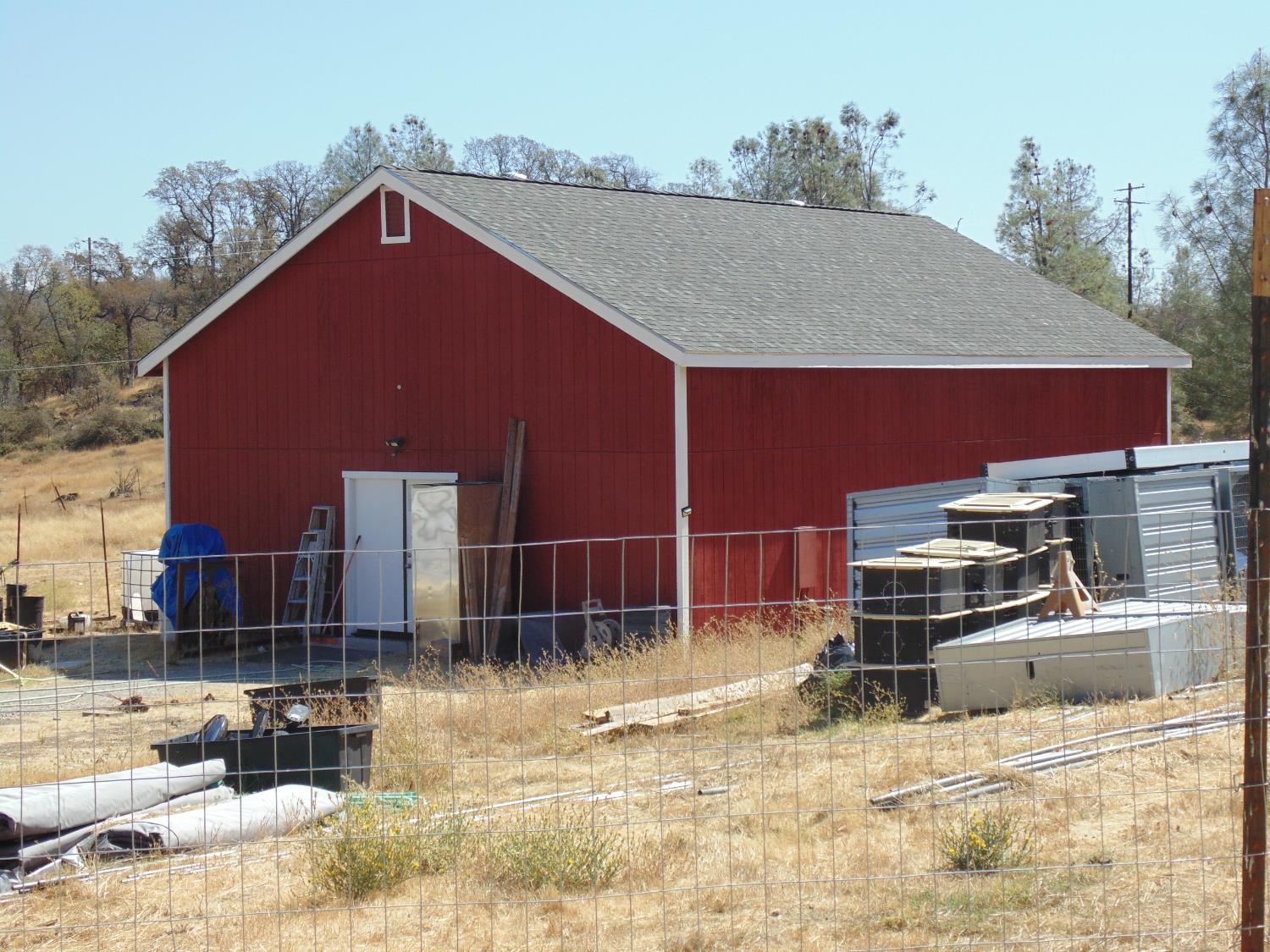 4161 Ginger Road Garden Valley, CA 95633 - Photo 3 of 32 a backyard of a house with barbeque oven