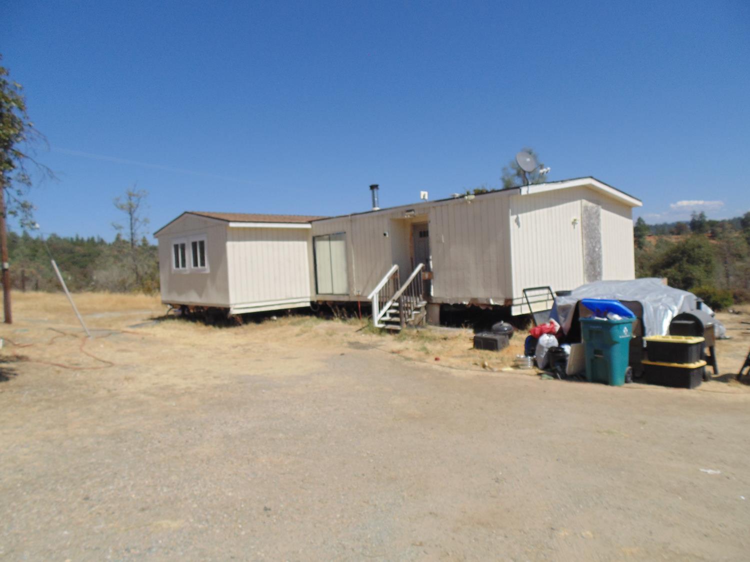 4161 Ginger Road Garden Valley, CA 95633 - Photo 5 of 32 a view of a car parked in front of a house