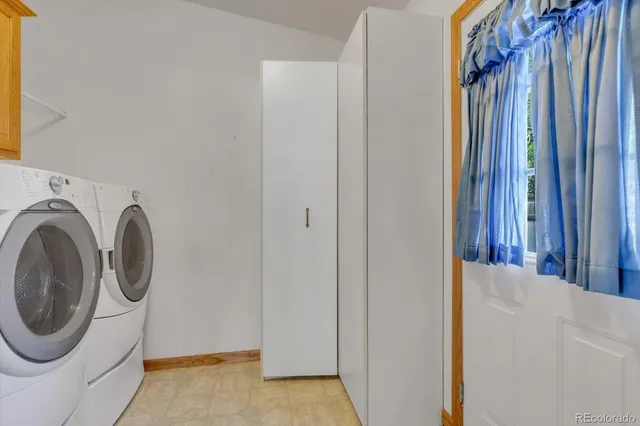 a view of a hallway with washer and dryer