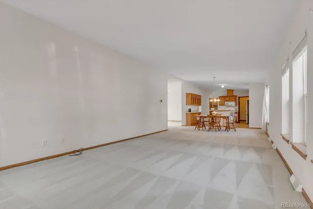 a view of a livingroom with furniture and a window