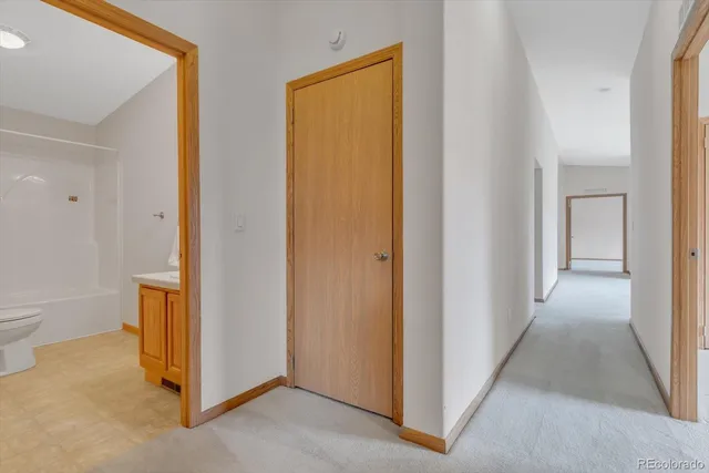 a view of a hallway with closet