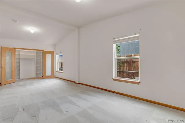 an empty room with windows