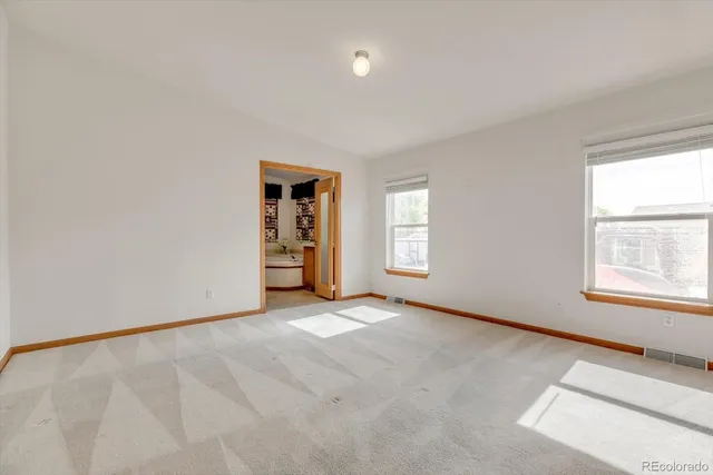 an empty room with windows