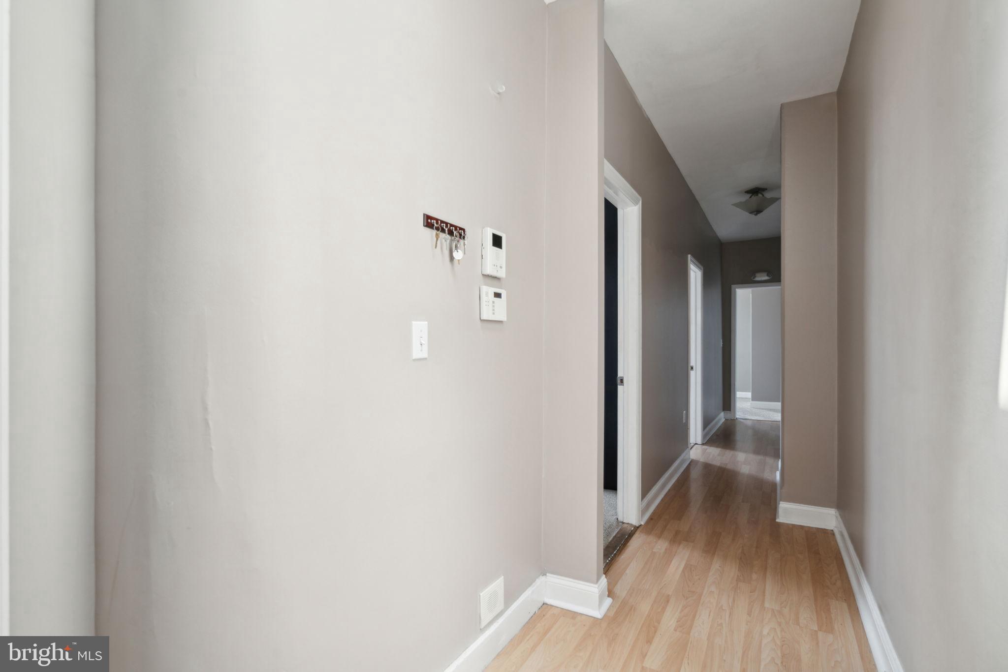 1936 North 7th Street, Unit 3 Philadelphia, PA 19122 - Photo 13 of 29 a view of a hallway with wooden floor
