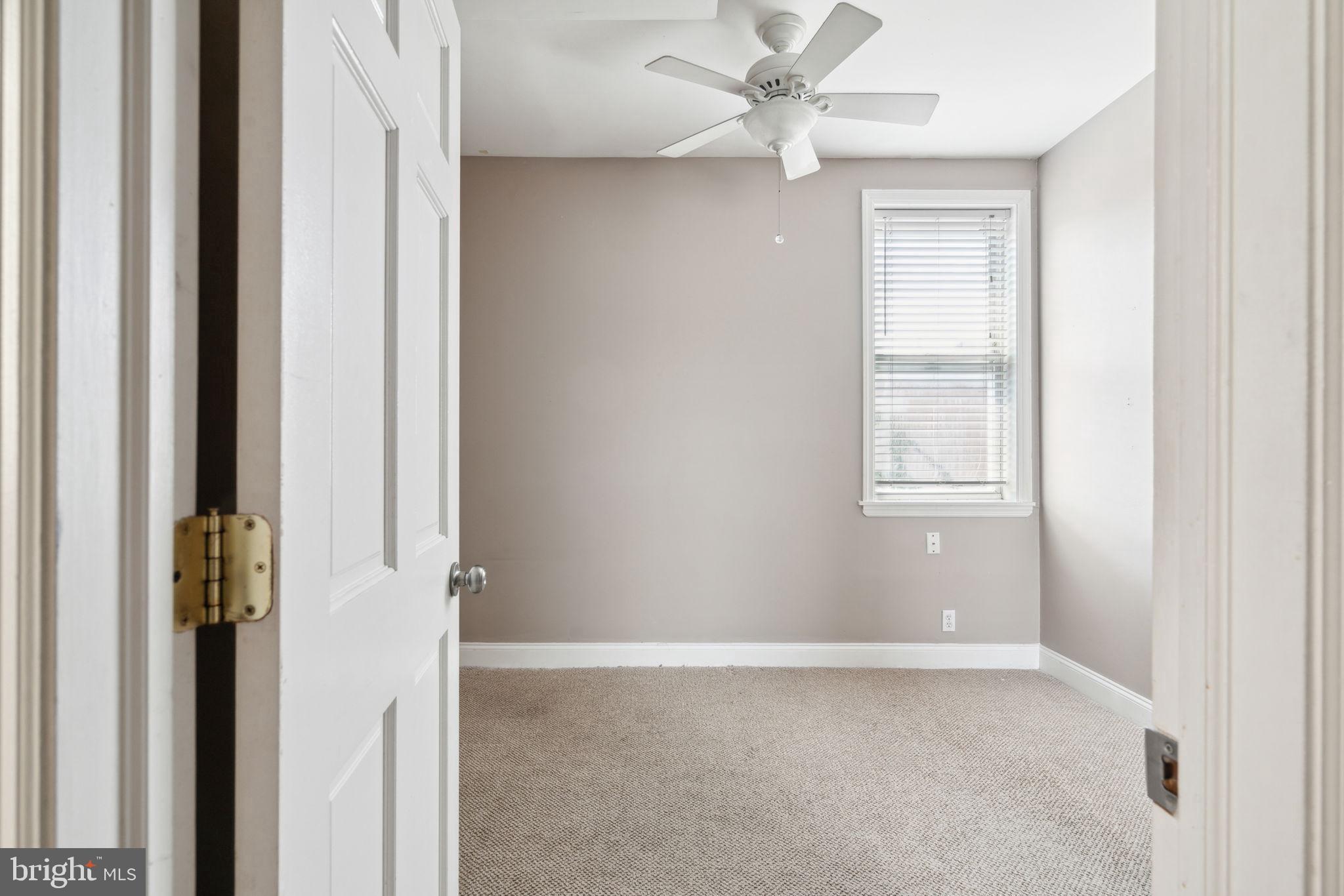 1936 North 7th Street, Unit 3 Philadelphia, PA 19122 - Photo 18 of 29 an empty room with windows and fan