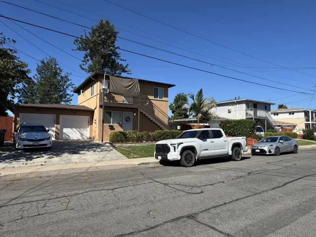 a view of street with parked cars
