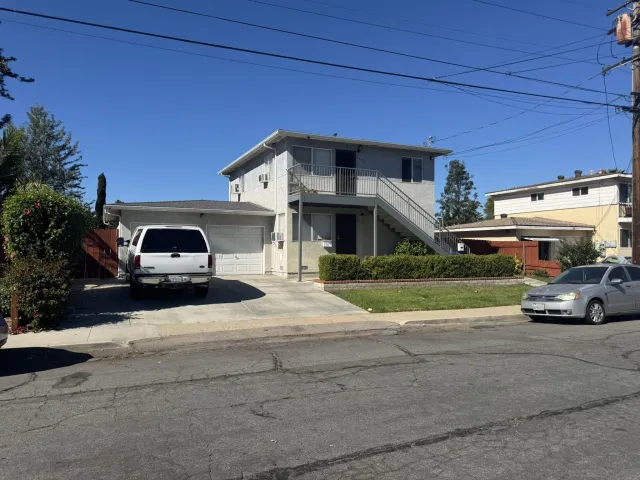 a view of a car parked in front of a house